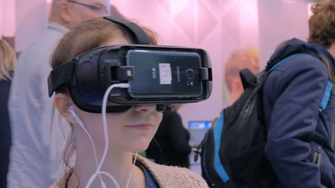 Young woman using virtual reality glasses Stock Footage