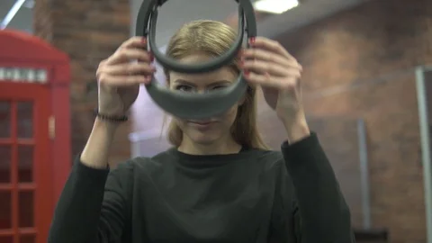Young woman using Virtual Reality Glasses. Virtual reality mask. VR. Future and Stock Footage 87167261