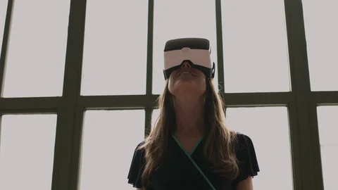 A young woman using virtual reality headset, shot in 4k Stock Footage 122302452