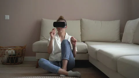 Young woman using virtual reality headset play game. Concept of virtual reality Stock Footage 157401713