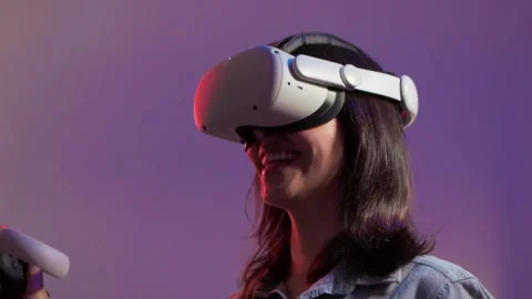 Young Woman Using Virtual Reality Glasses in Slow Motion in Apartment Stock Footage 218384063