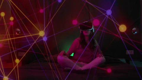Young Woman Using Virtual Reality Headset And Looking Around On Colorful Video stock 220823969