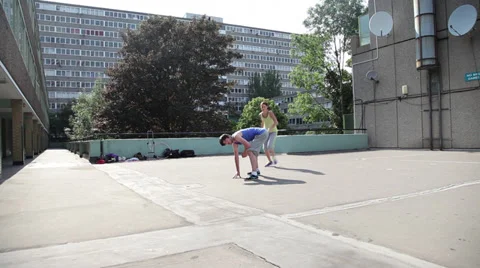 A young woman vaults over a man Stock Footage 35402853