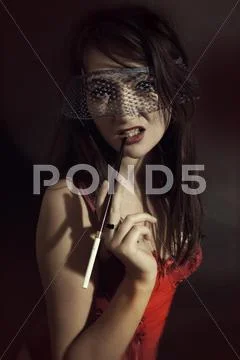 Young woman in a veil of cigarette Stock Photos