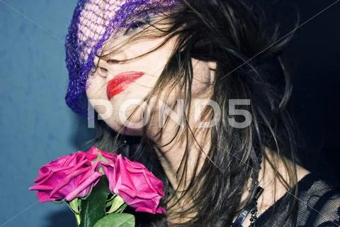 Young woman in the veil with roses Stock Photos