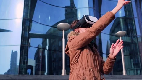 A young woman in the virtual glasses in the open air Stock-Footage 74502053