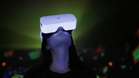 Young woman in virtual reality studio, simulation glasses technology Stock Footage 229699019