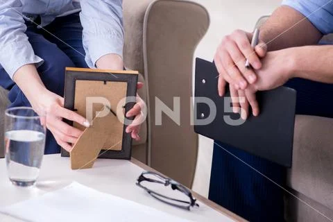 Young woman visiting male psychologist for unreciprocated love Stock Photos