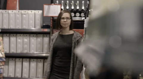A young woman visiting a store Stock Footage