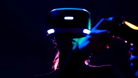Young woman in VR headset using gamepad have fun and play interactive video game Vidéo 87885578