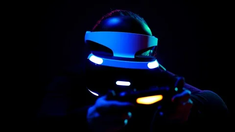 Young woman in VR headset using gamepad have fun and play interactive video game Video stock 87885698