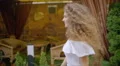 The young woman walk along the restaurant terrace. Slow motion. Wide angle 4k or 4k+ Resolution