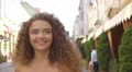 The young woman walk on the street. Slow motion. Wide angle 4k or 4k+ Resolution