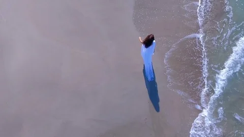 Young Woman Walking on the beach Stock Footage
