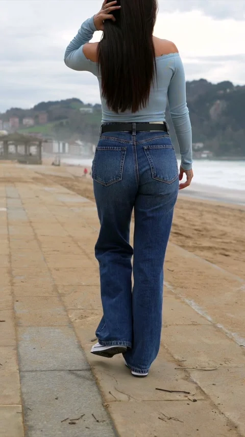 Young woman walking on beach path, different perspectives Stock Footage 308010793