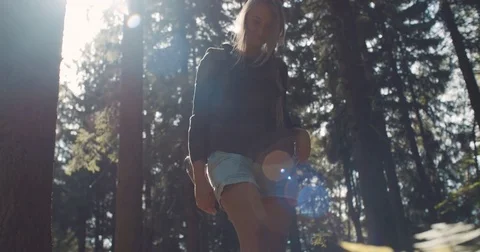 Young woman walking in a forest. 動画素材 80797014