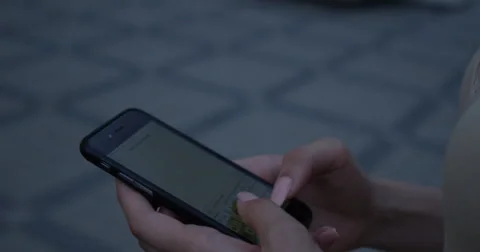 Young woman walking hands using smartphone to text message Stock Footage 66432182