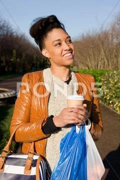 Young woman walking in the park Stock Photos