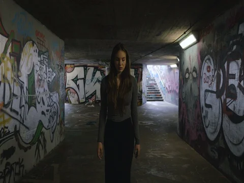 Young Woman Walking in an Underground Passageway 2 Stock Footage