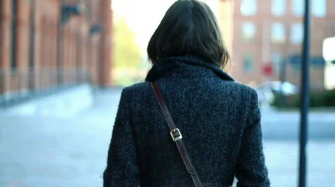 Young woman walking in an urban environment, steadicam shot Stock Footage