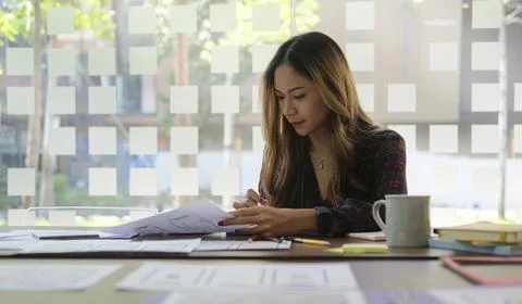 Young woman web developer is designing smartphone application layout prototyp Stock Photos