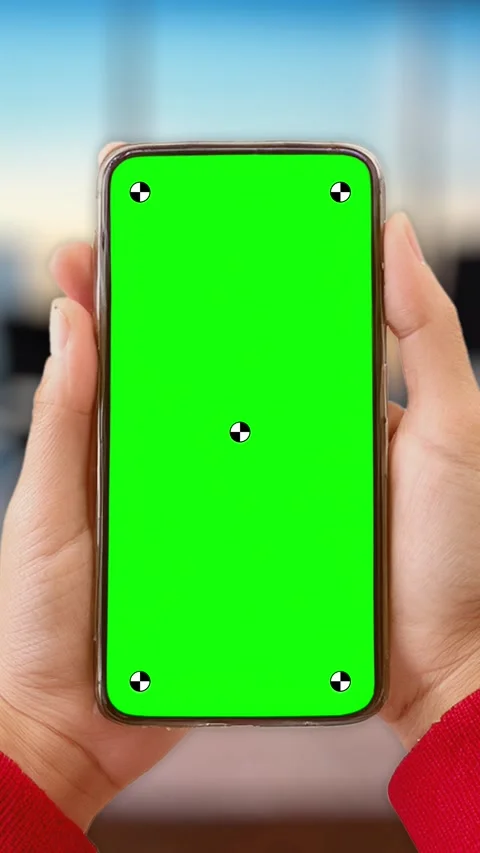 Young woman in work office using smartphone with green mock up screen chroma key Stock Footage 306171970