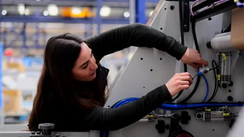 Young woman working and using screwdriver. Stock Footage 260577233