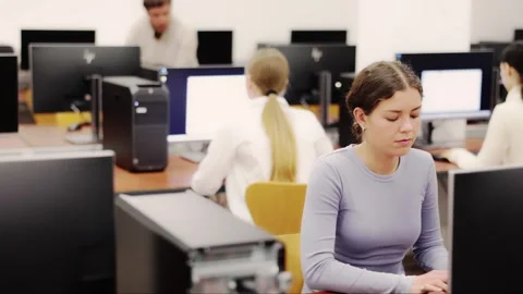 Young woman working on computer in office Stock Footage 344776590