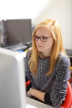 Young woman working on computer Stock Photos