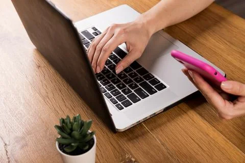 Young woman working on computer at table in office, closeup. Banner design Stock Photos