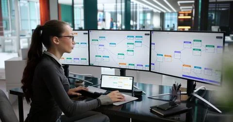 Young Woman Working On Computer Using Smart Software To Improve Workflow. Stock Photos