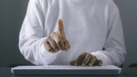 Young woman working in front of the computer on the desk Stock Photos