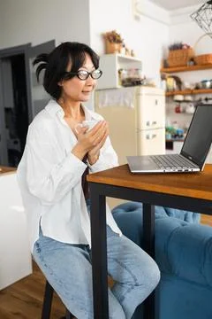 Young woman working at home, using laptop computer with blank green screen Stock Photos