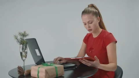 Young woman working in the office using computer is cheching the list of workers Stock Footage 157936484