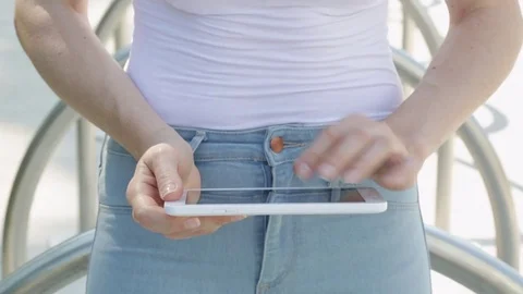 Young woman working on tablet computer, outdoor Video stock 72346287