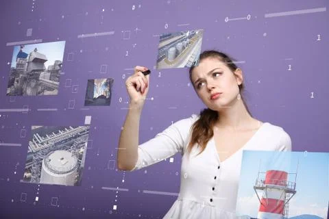 Young woman working with virtual interface. Engineer-technologist. Stock Photos
