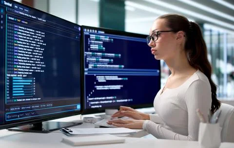 Young Woman Writes Secure Code Using Cloud-based Programming Tools Online. Stock Photos