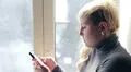 Young woman writes a sms HD Footage