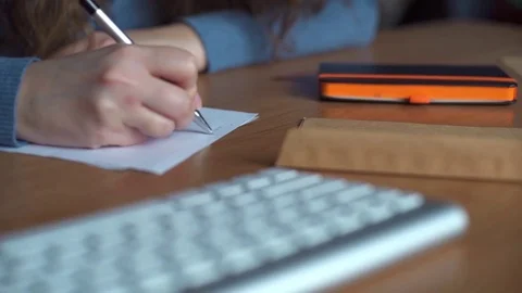 Young woman writing a letter Stock Footage