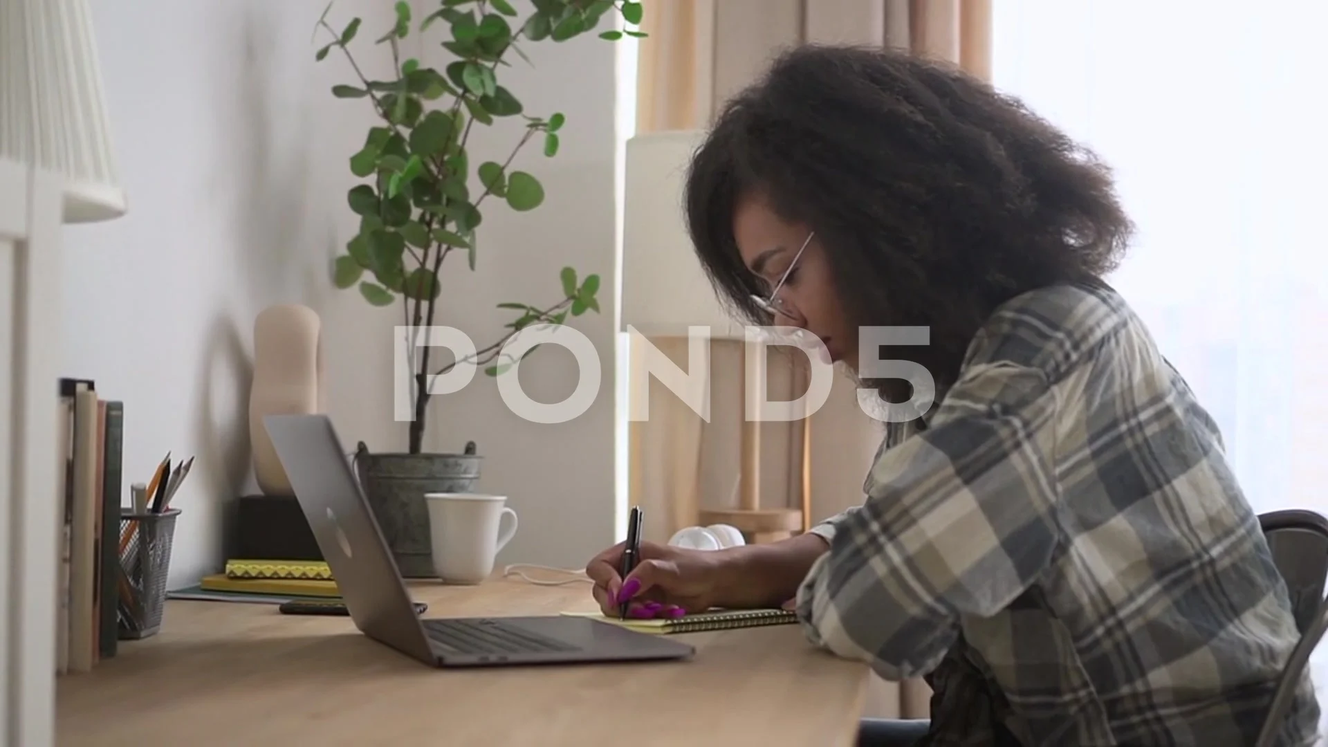 https://images.pond5.com/young-woman-writing-notebook-and-footage-201278929_prevstill.jpeg