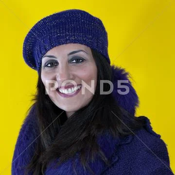 Young woman with yellow background Stock Photos