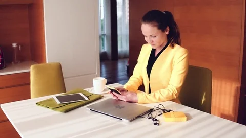Young woman in yellow jacket using phone Video stock 73426702