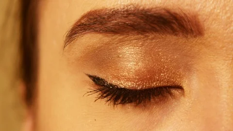 Young woman's eye close up. Text COVID-19 reflected inside. Coronavirus theme Stock Footage 128145483