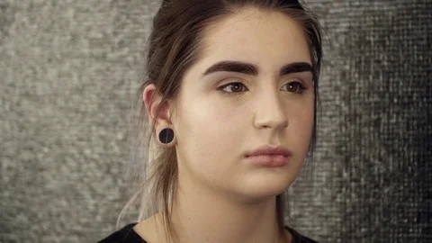 Young woman's face closeup after the eyebrow correction procedure Stock Footage 73677237