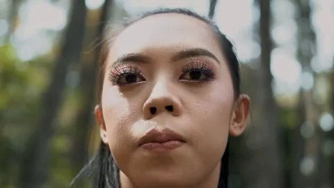 Young Woman's Face Looking Upwards in Sunlight Forest, Serene and Peaceful Stock Footage 334791917