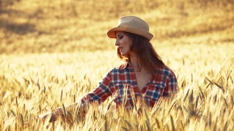 A young woman's hand touching the grass in a wheat field. Young farmer. Stock Footage 132138903