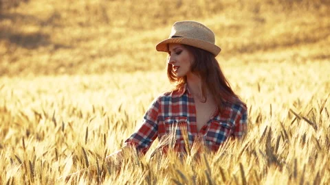 A young woman's hand touching the grass in a wheat field. Young farmer. Stock Footage 132138904