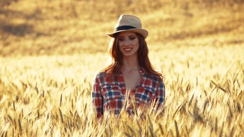 A young woman's hand touching the grass in a wheat field. Young farmer. Stock Footage 132138977
