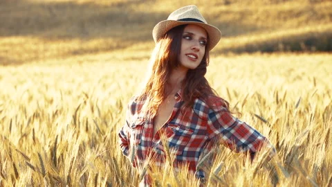 A young woman's hand touching the grass in a wheat field. Young farmer. Stock Footage 132139172