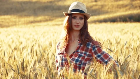 A young woman's hand touching the grass in a wheat field. Young farmer. Stock Footage 132139201